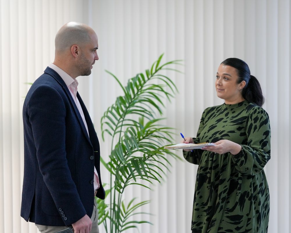 Paragon Marketing team in a standing discussion